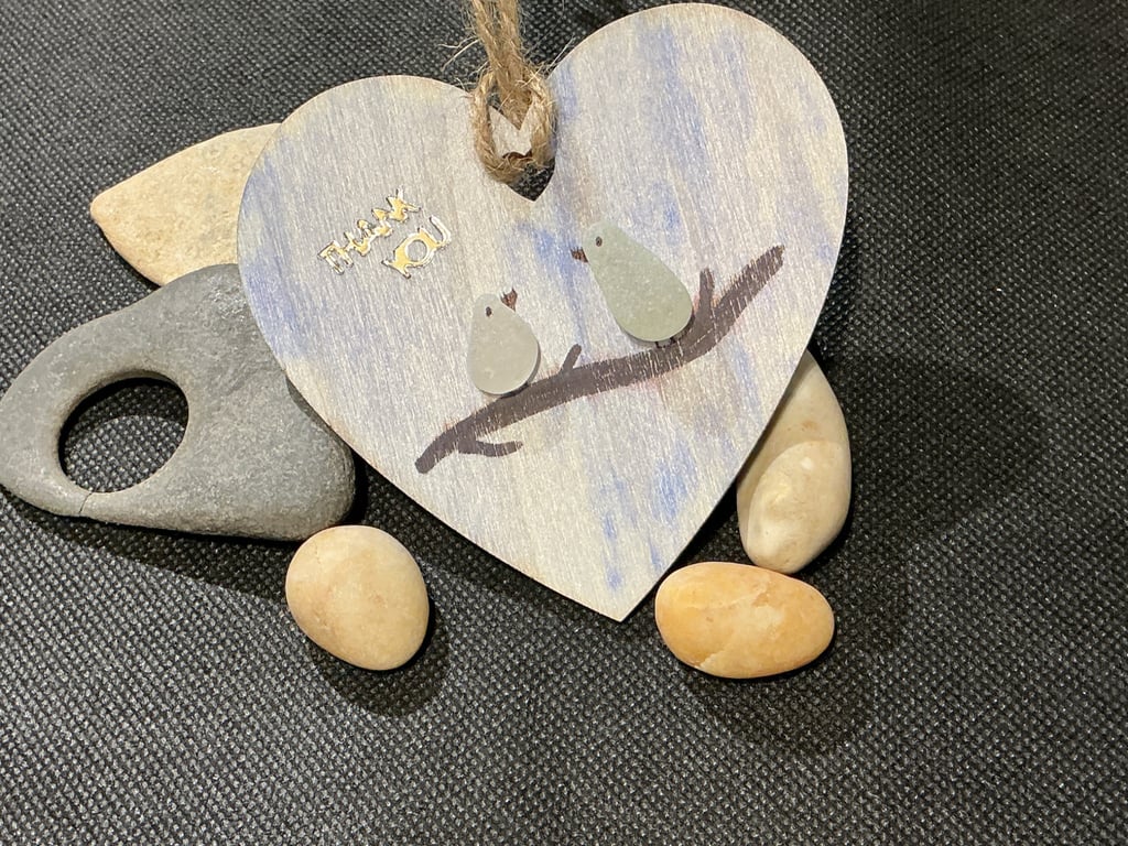 Wooden heart with 'thank you' sentiment and birds on a branch.