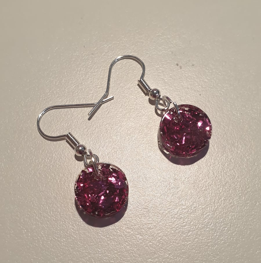 Round pink metallic flakes resin earrings