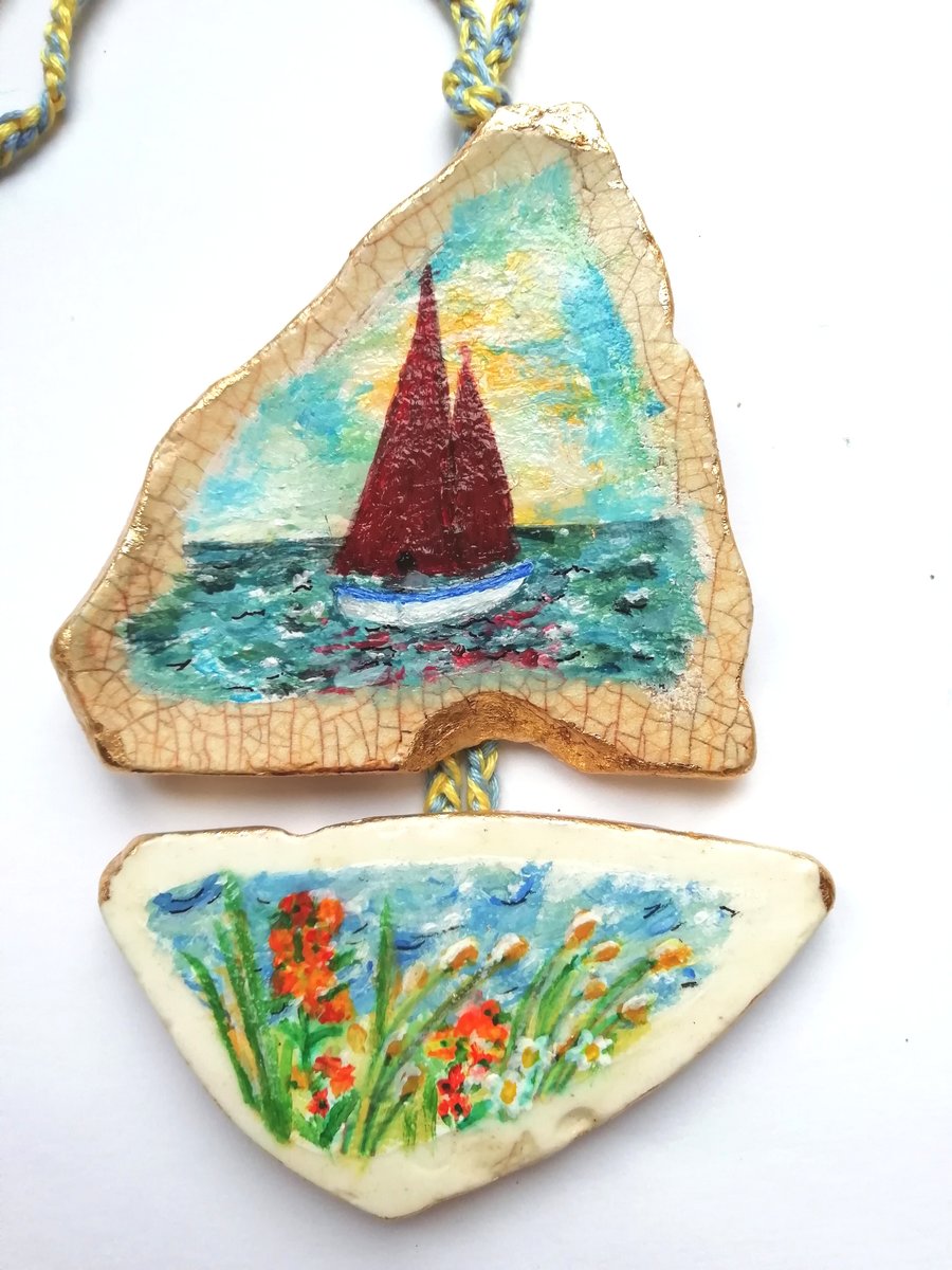 Boat and wallflower pottery hanging
