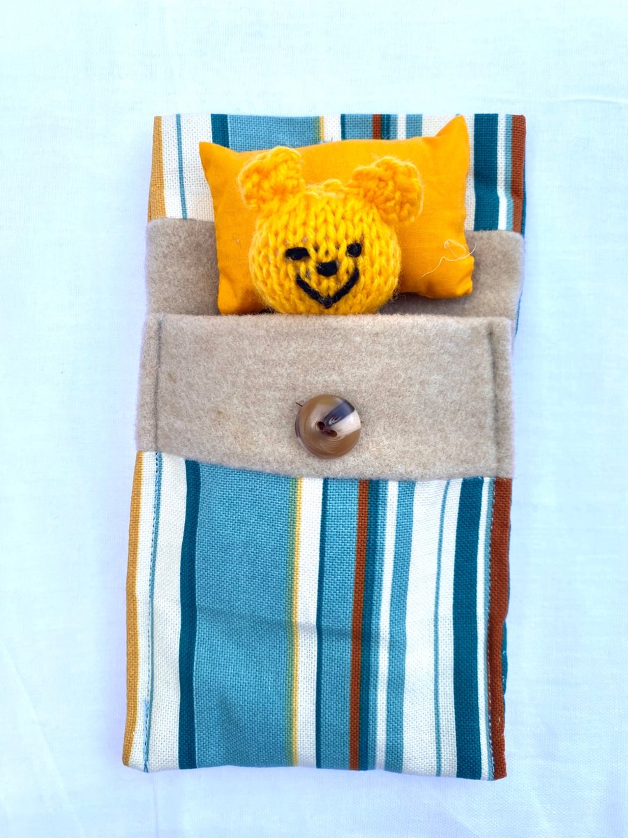 Ted in a bed, cute companion bear 