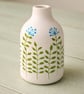 Small vase with hand drawn doodles. 