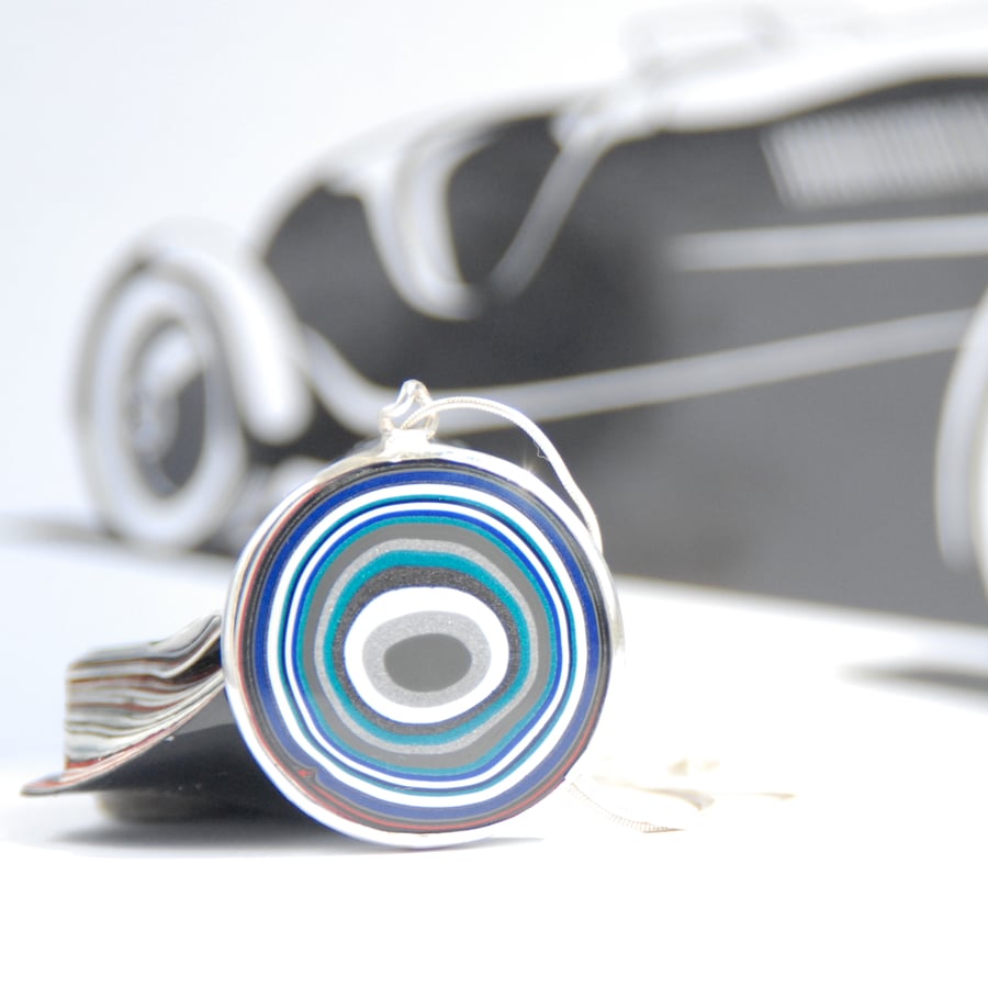 Circular Jeep fordite pendant (blue and teal)