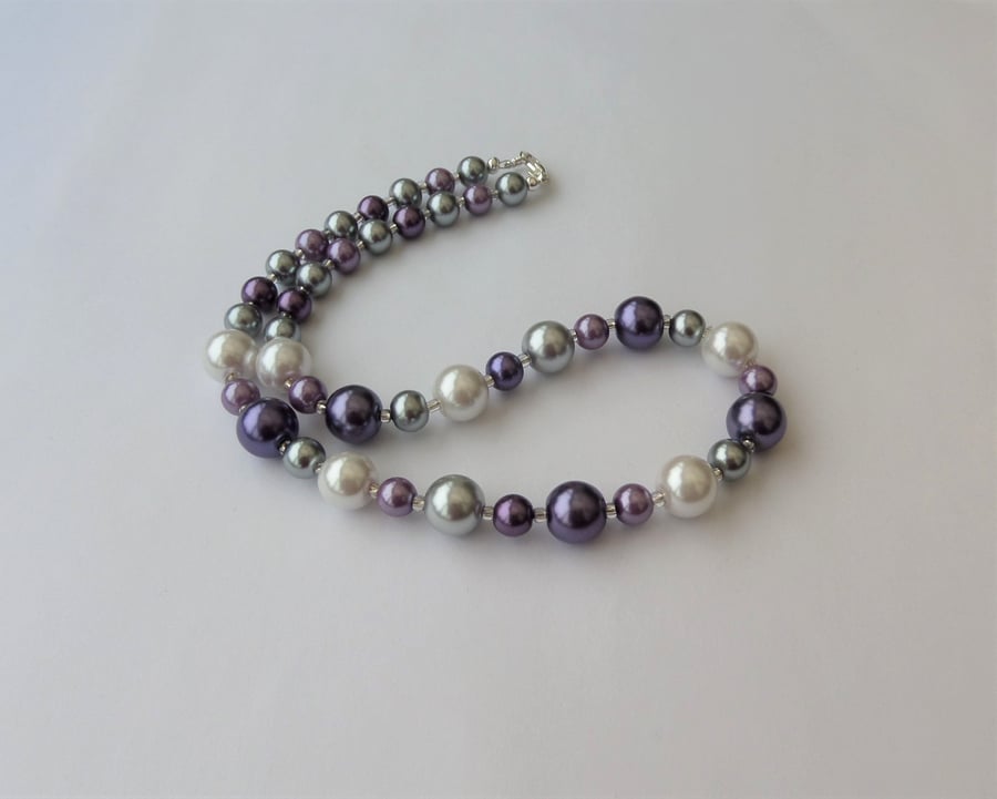 White, silver, grey and purple glass pearl bead necklace. 