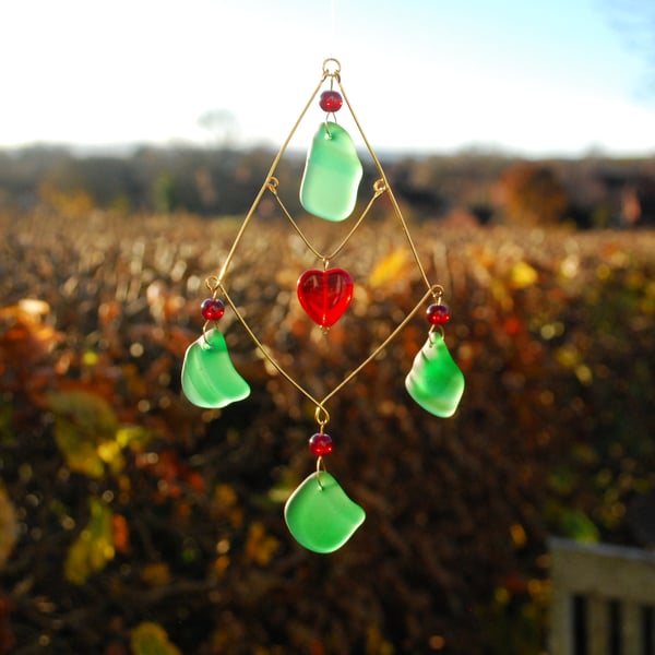 Green sea glass sun catcher with red heart