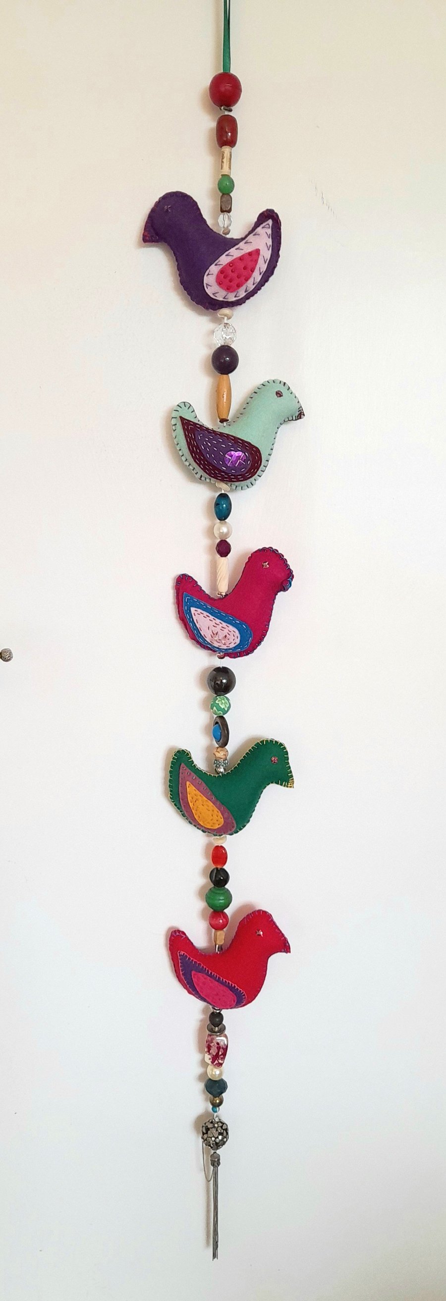 Sweet Tweets - A skein of decorated felt birds, joined with beads, ready to hang