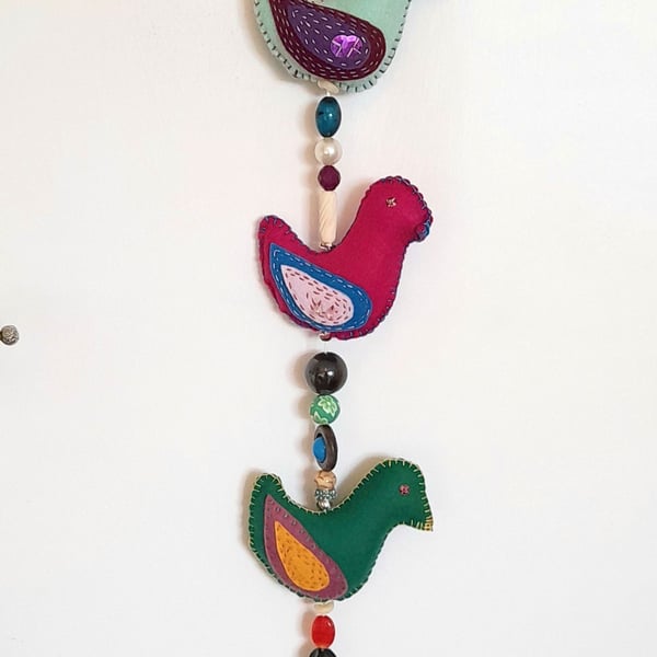 Sweet Tweets - A skein of decorated felt birds, joined with beads, ready to hang