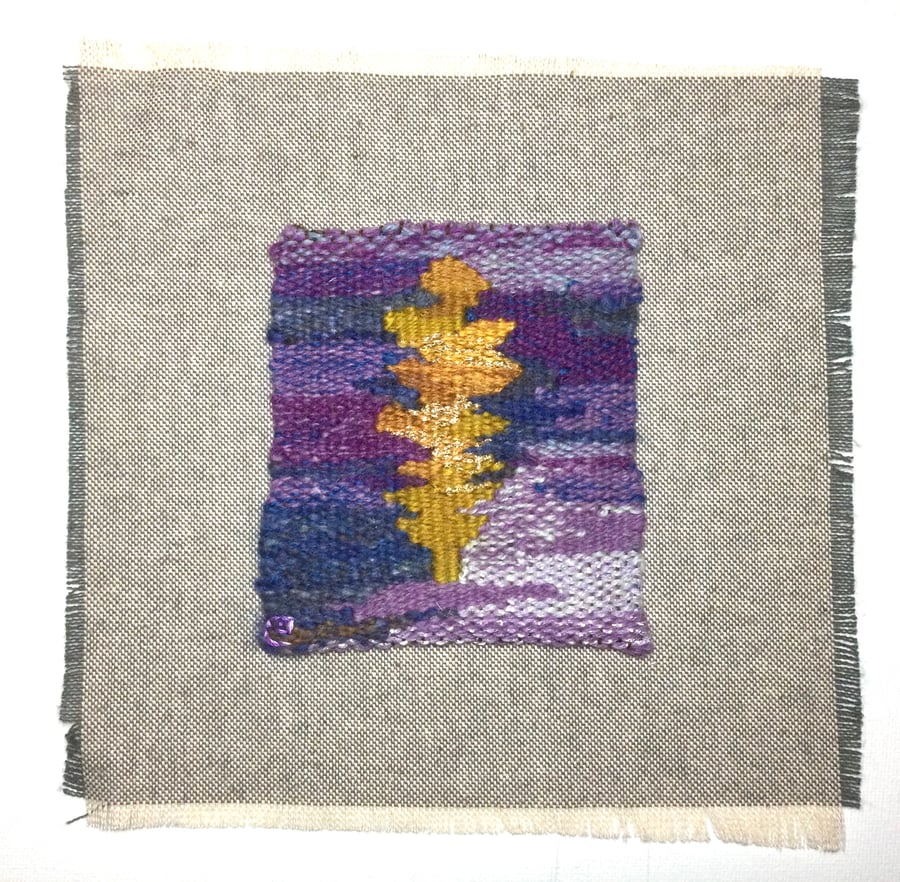 Unframed handwoven tapestry weaving, textile art in purple, yellow, and blue