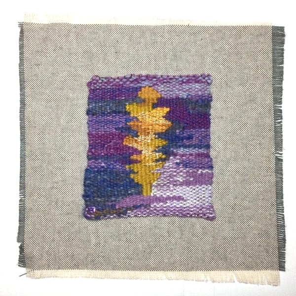 Unframed handwoven tapestry weaving, textile art in purple, yellow, and blue