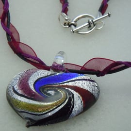 A Murano style foil glass heart pendant