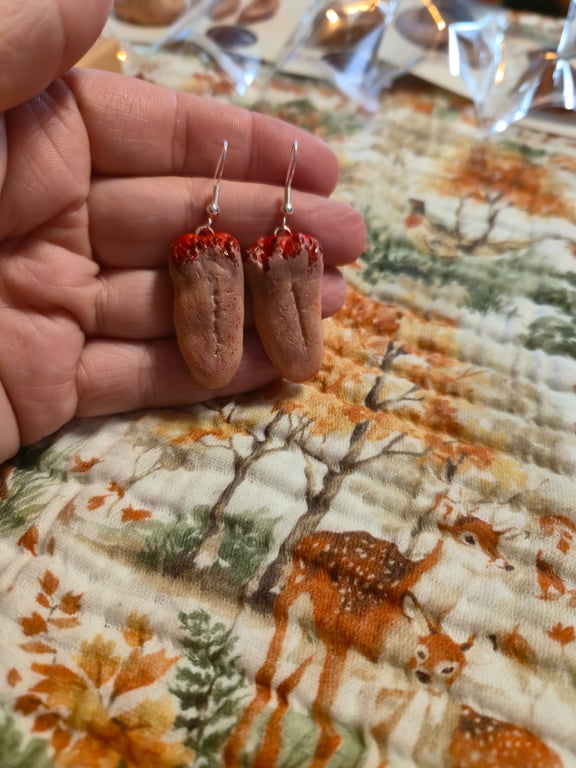 Serial killer trophy ripped out tongue earrings 