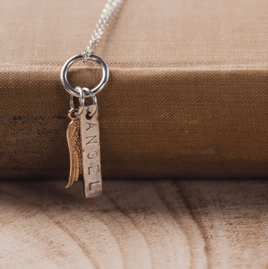 Silver handstamped angel pendant with rose gold wings