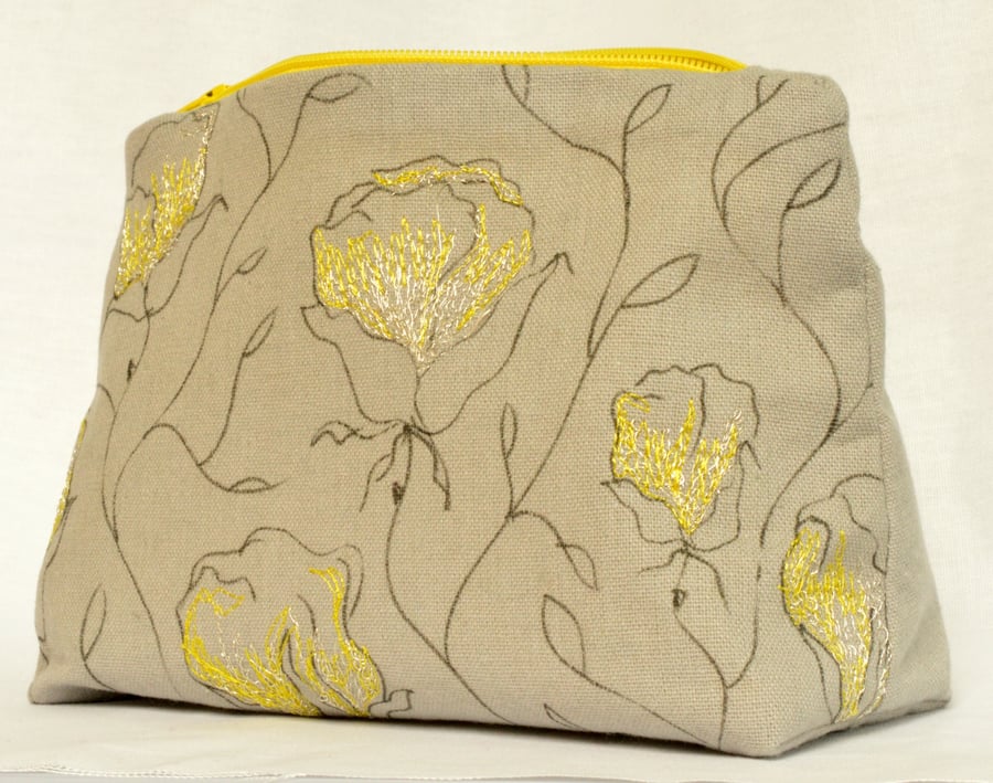 Make up bag with hand drawn and machine embroidered floral design 