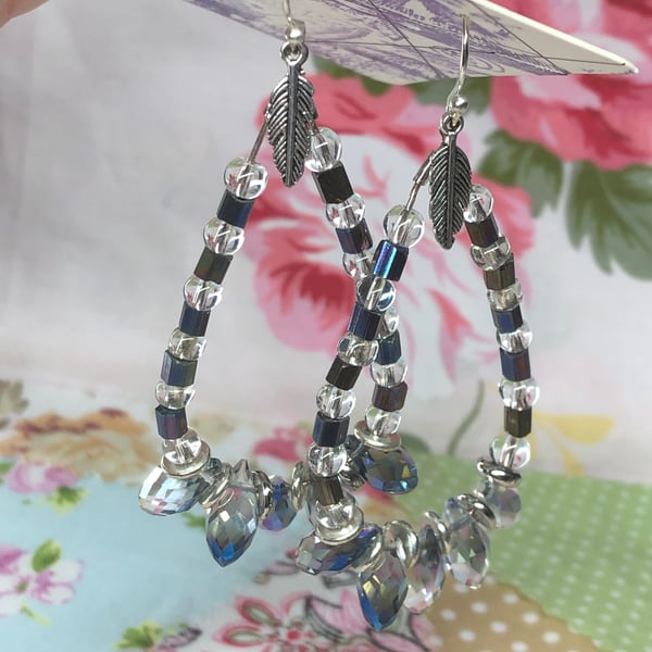 Teardrop hoop earrings with feathers and crystal beads