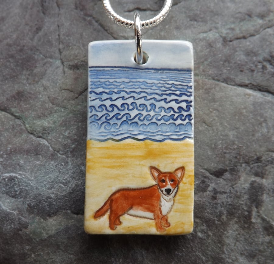 Handmade Ceramic Corgi dog on the beach pendant