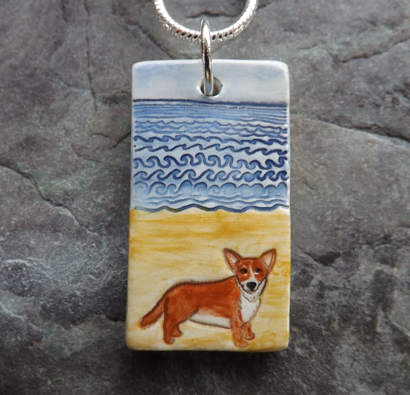Handmade Ceramic Corgi dog on the beach pendant