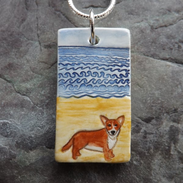 Handmade Ceramic Corgi dog on the beach pendant