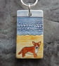 Handmade Ceramic Corgi dog on the beach pendant - Image 1