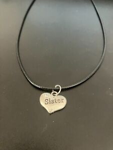 sister heart charm pendant on a 18" leather cord necklace