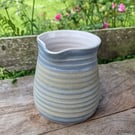 Hand-thrown, decorative stoneware jug in "granite" glaze 