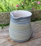 Hand-thrown, decorative stoneware jug in "granite" glaze 