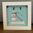 Christmas pebble art of a snowman