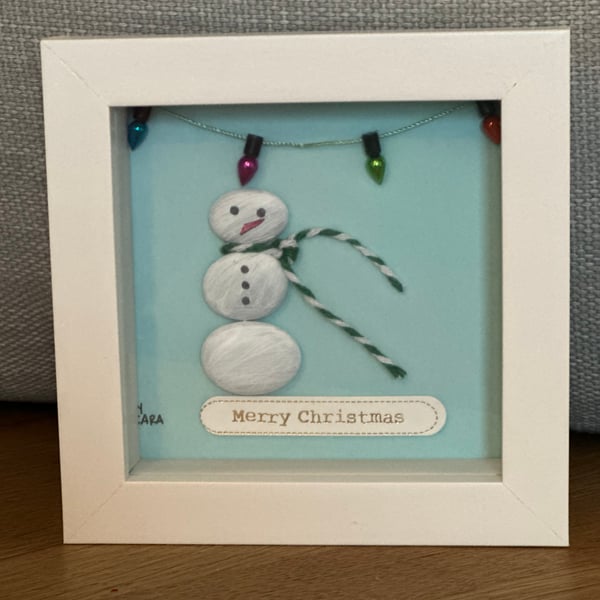 Christmas pebble art of a snowman