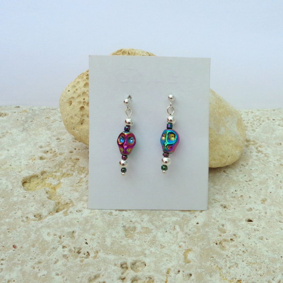 Small stud silver plated drop earrings with tiny, bright skull glass beads