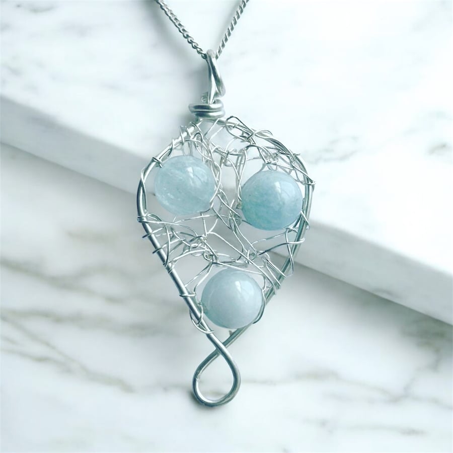 Wire wraoped sterling silver wire necklace with aquamarine gemstones
