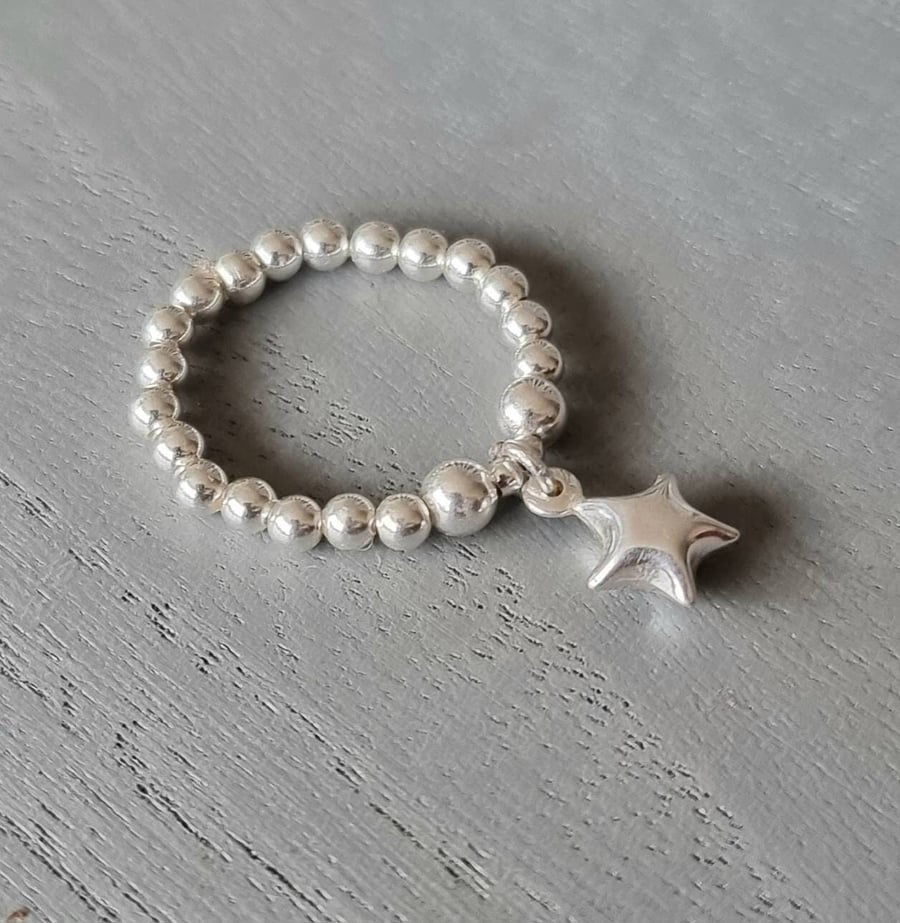 PEARL RING W/STAR CHARM PEARL RING W/STAR CHARM