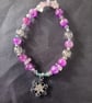 Elasticated beaded winter bracelet with crystal chip and silver snowflake charm  - Image 2