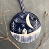 Ceramic Winter scene hanging decoration.