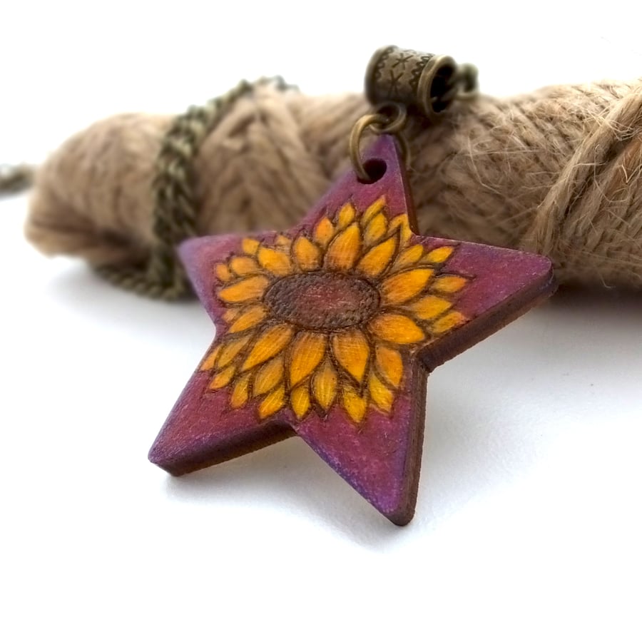 Sunflower on purple pyrography pendant. Floral star necklace.