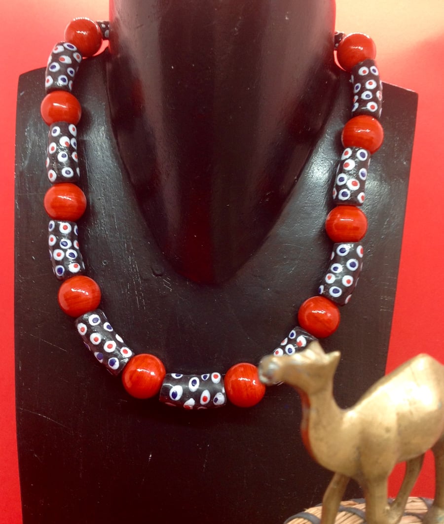  African necklace with chunky round red and black patterned glass beads