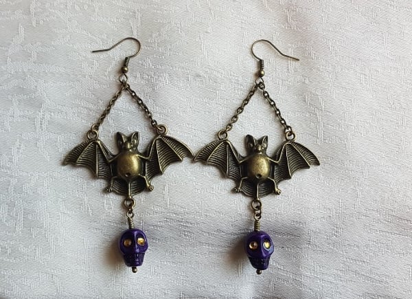 Spooky Antique Bronze Bat Earrings with Purple Skulls.