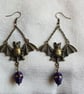 Spooky Antique Bronze Bat Earrings with Purple Skulls. - Image 1