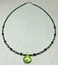 Green beaded necklace with pendant
