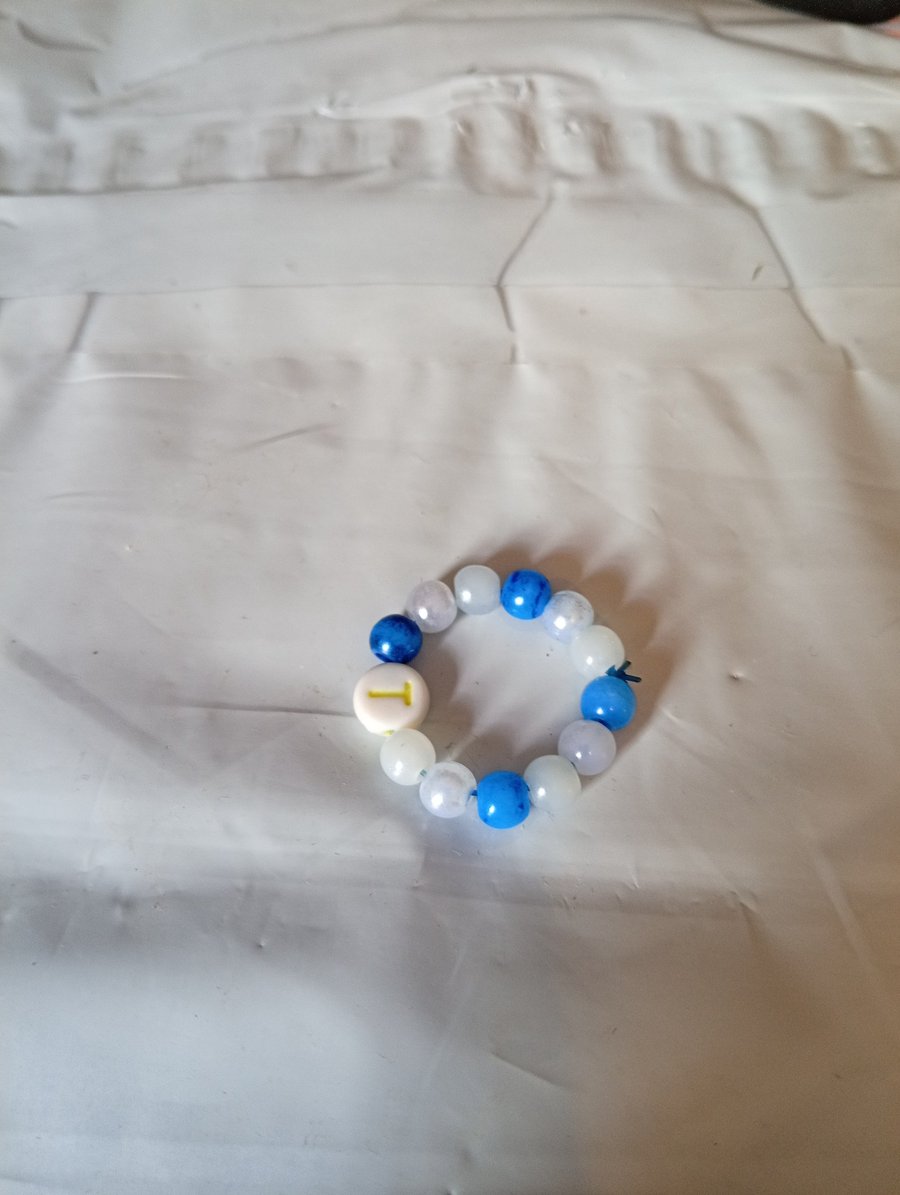 Initial ring with bead