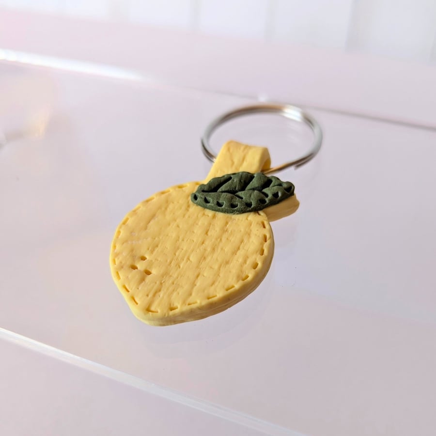 Lemon leather effect keychain.