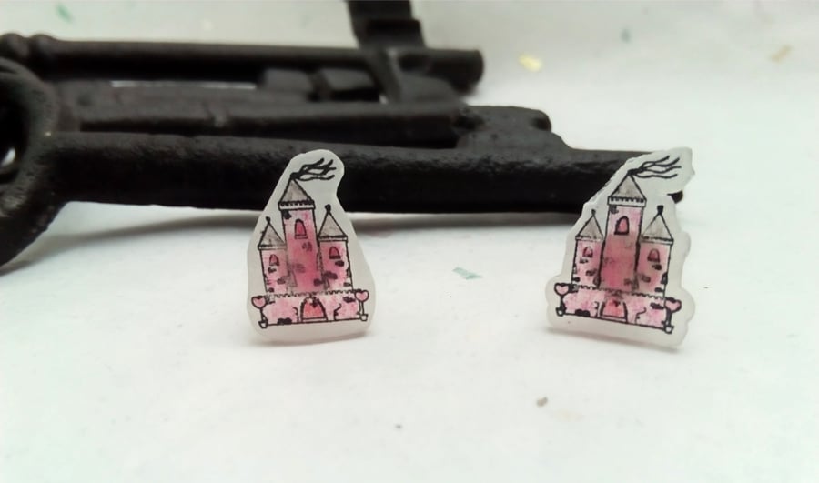 Pink Castle stud earrings on frosted shrink plastic