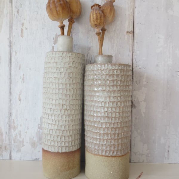 Hand-built stoneware pottery carved bottle in satin white glaze