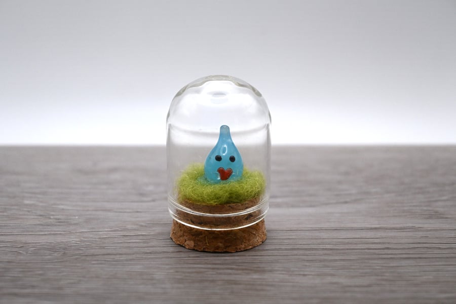 small glass wisp with heart