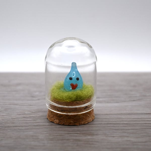 small glass wisp with heart