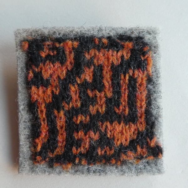 Rule 30 brooch - pale grey with orange and black, square, needle felted.