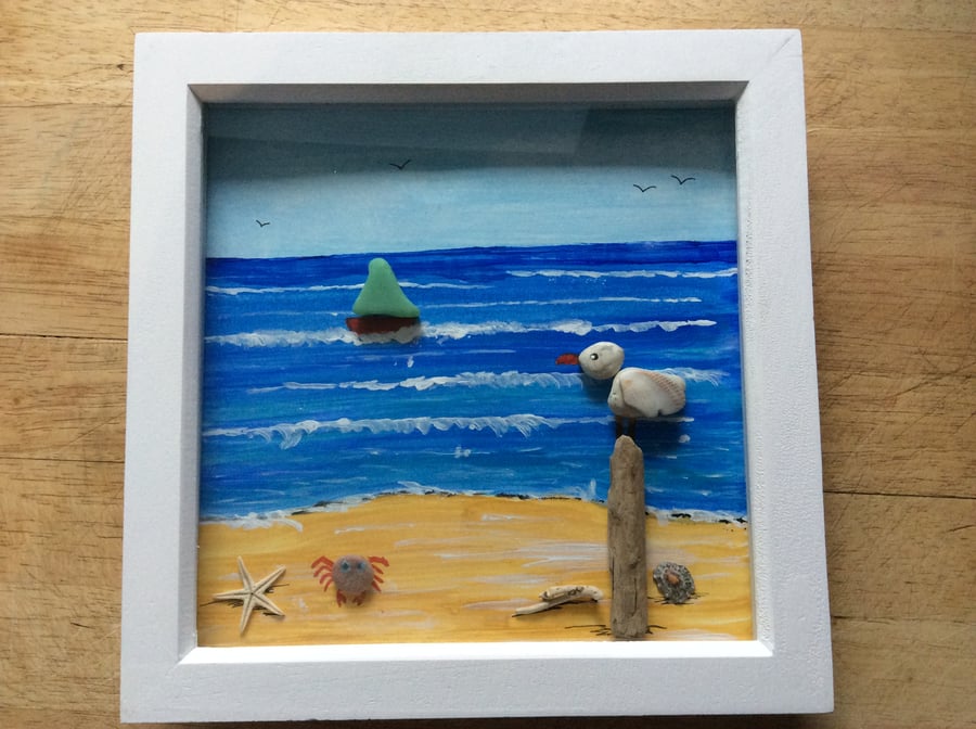 Pebble Art Picture. Seaside scene, pebble seagull on post.