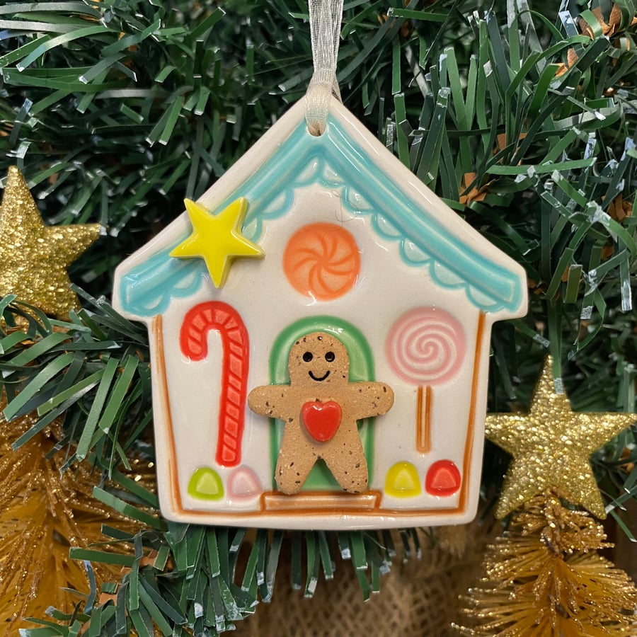 Pottery Gingerbread house decoration with teeny gingerbread man