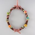 Wreath Decor for Spring in Pink with pastel paper decorations. Easter Gifts.