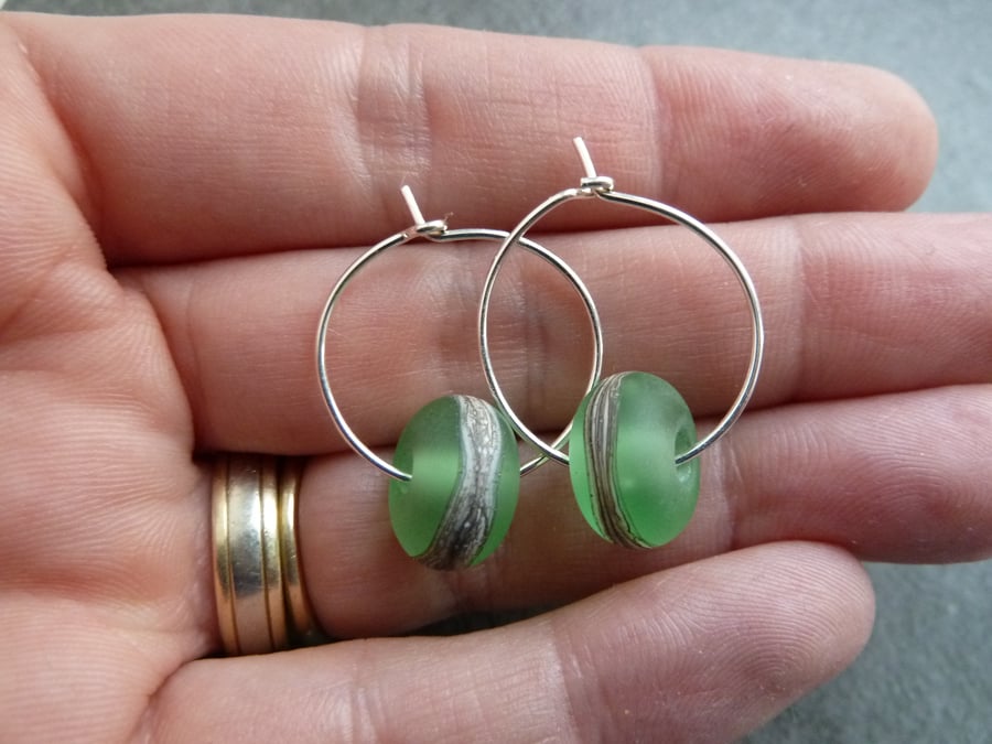 sterling silver hoop earrings, green lampwork glass
