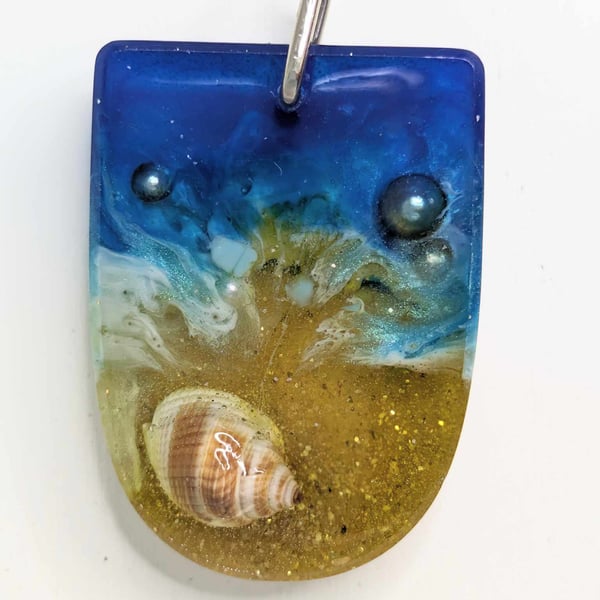 Beach Resin Pendant With Protruding Shell