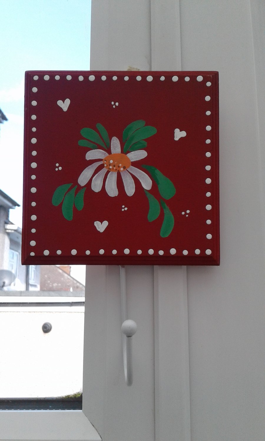 Hand painted red daisy coat peg.