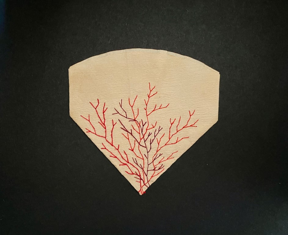 Hand stitched upcycled coffee filter embroidery art